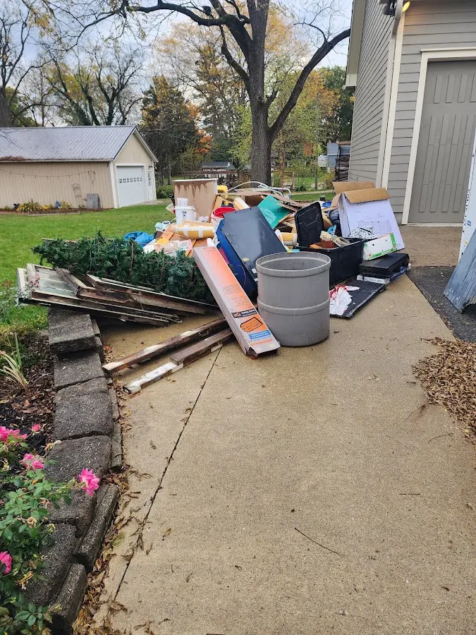 Dumpster being loaded with debris for 3 Yard Dumpster Rental in Ridley Park